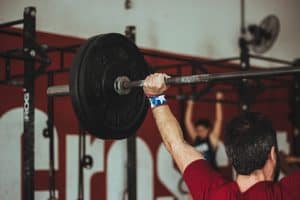 Man lifting weights in a gym