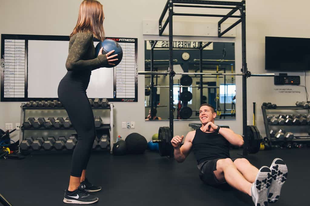 Fitness duo doing core exercises