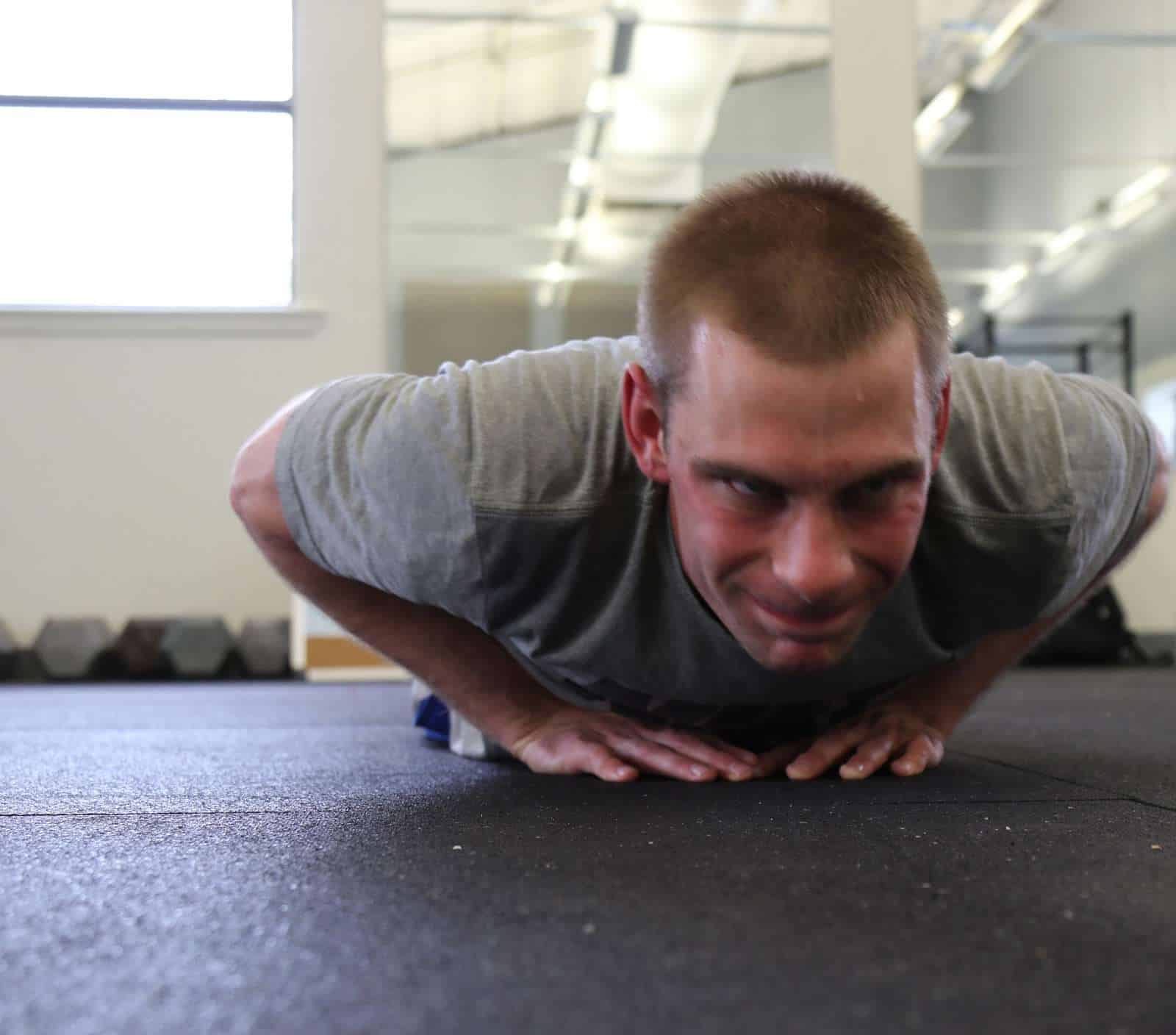 A man completes a diamond pushup