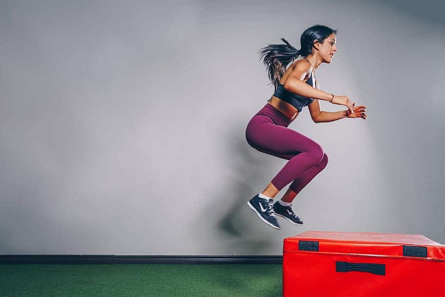 A woman doing jump squats