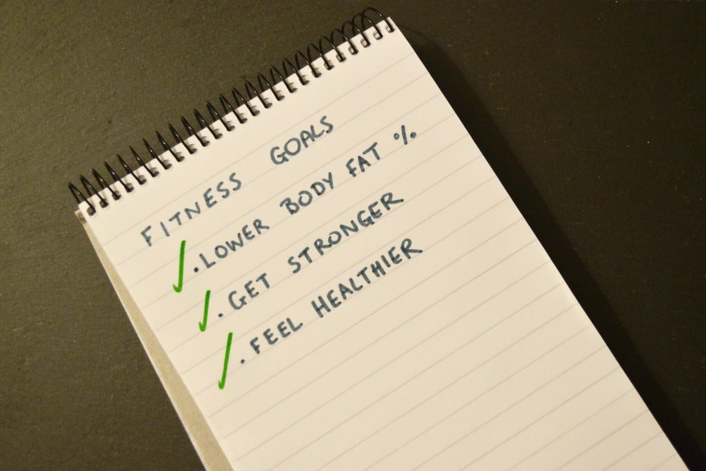 Fitness goals list in a notebook