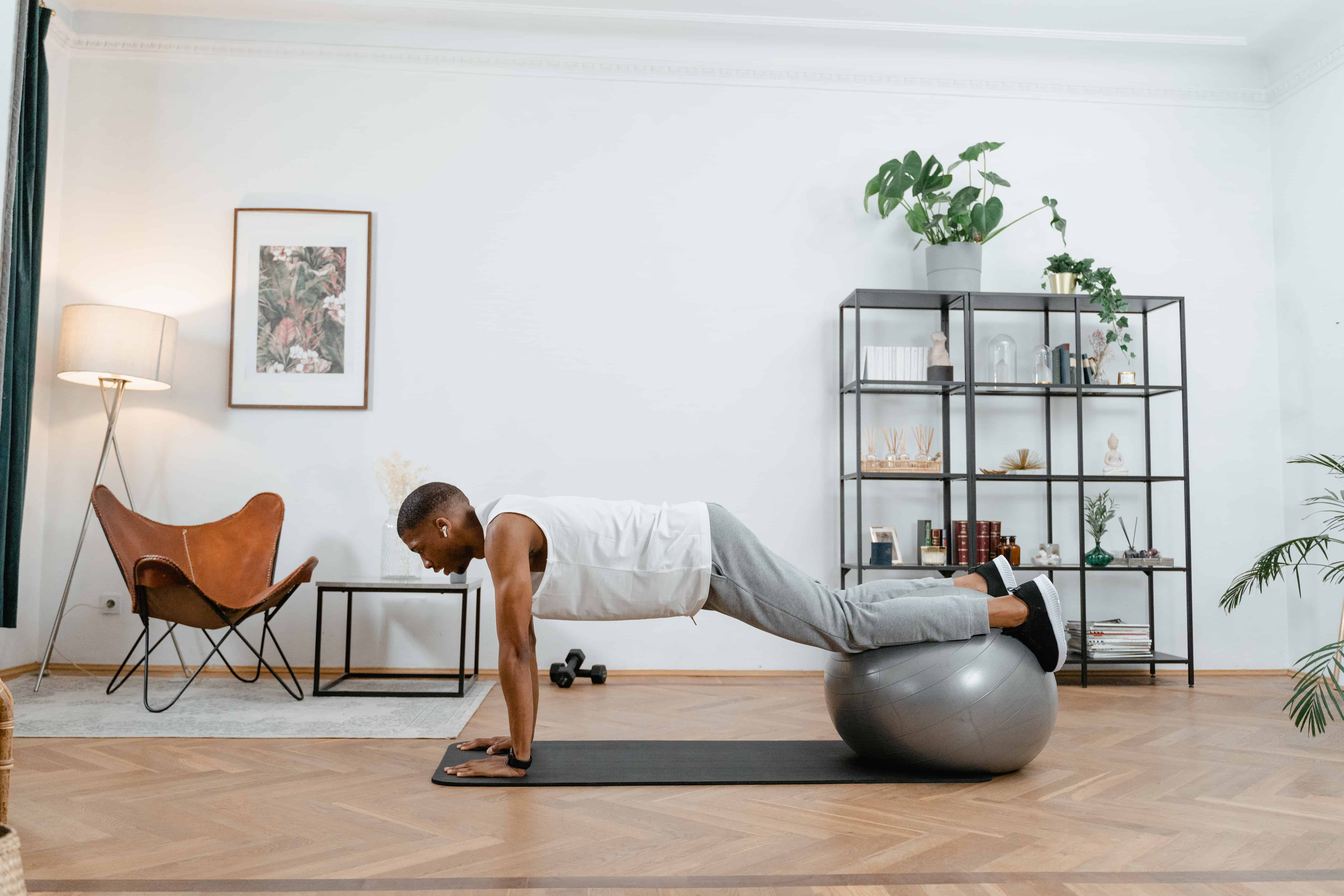 A man working out on a yoga ball