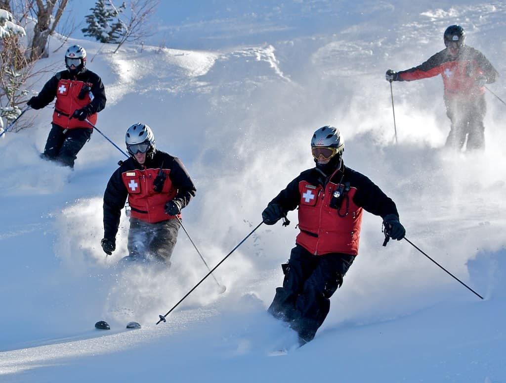 Powder mountain ski patrols in action.