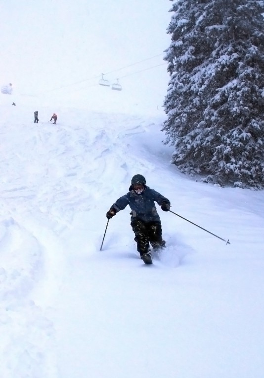 A skier skiing in Kvitfjell.